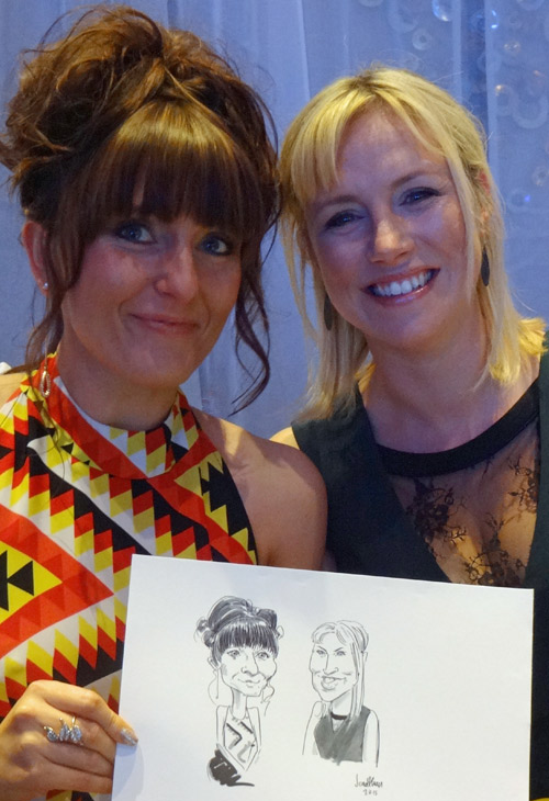 photo of guests with their caricature at birmingham's nec